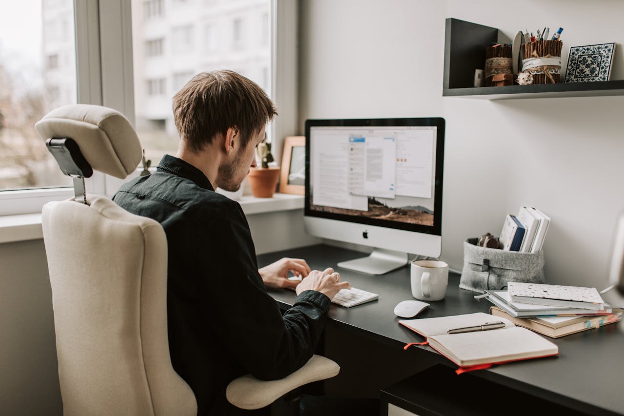 Photo Of Man Using Computer